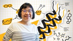 Xiaoqin Zou in front of illustrated protein structures.